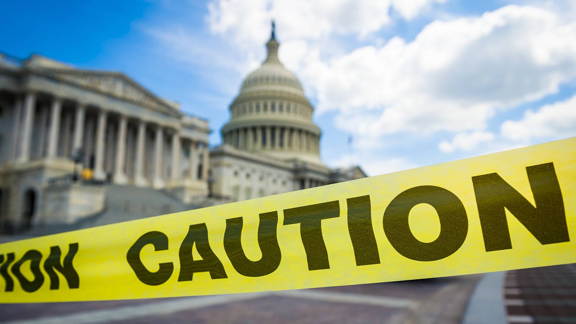 The U.S. Capitol Building with yellow caution tape.