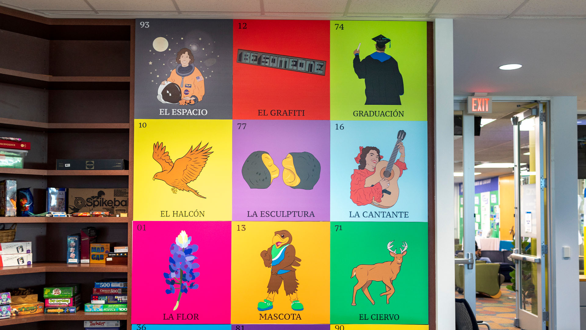 A brightly colored Loteria card, featuring figures and numbers for El Espacio, El Grafiti, Graduacion, El Hacon, El Esculptura, La Cantante, La Flor, Mascota, and El Ciervo